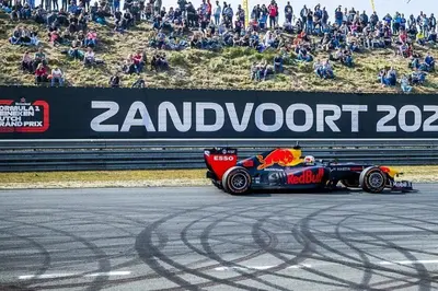 a racing car on a track with a crowd of people at Studio Garden View in Zandvoort