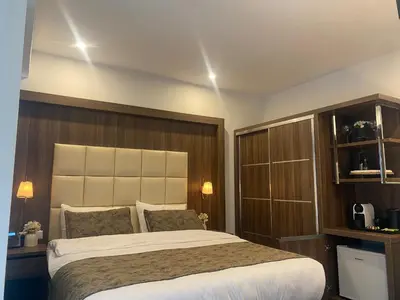 a bedroom with a large bed in a room at Hotel Cataleya in Almere