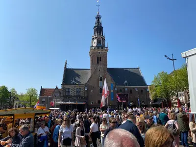 a large crowd of people standing in front of a building at Queen Suite Centre Alkmaar in Alkmaar