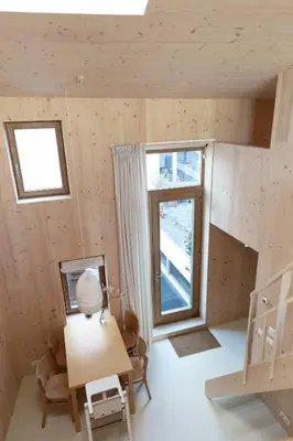 a small room with a table and a window at Noorderbed in Amsterdam