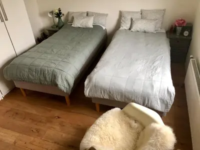 two beds sitting next to each other in a room at Family Beach House Zandvoort City Center in Zandvoort
