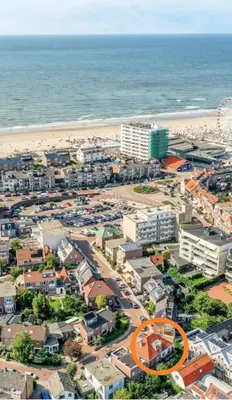 an aerial view of a city and the beach at Appartement van der Zee in Zandvoort