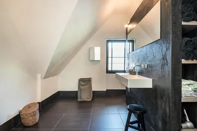a bathroom with a sink and a mirror at Villa Summer in Bergen