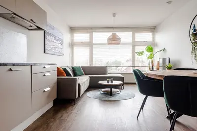 a living room with a couch and a table at De Schelp 85 in Zandvoort