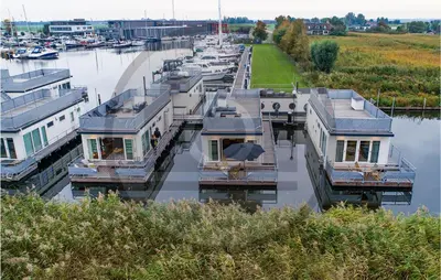 a group of boats parked in a marina at Amazing Ship In Aalsmeer in Aalsmeer