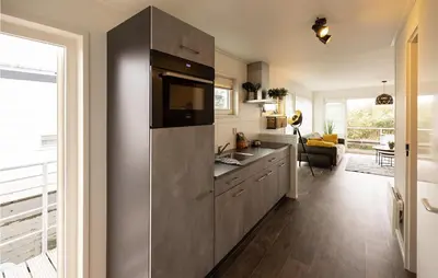 a kitchen with a large stainless steel refrigerator at 2 Bedroom Stunning Ship In Aalsmeer in Aalsmeer