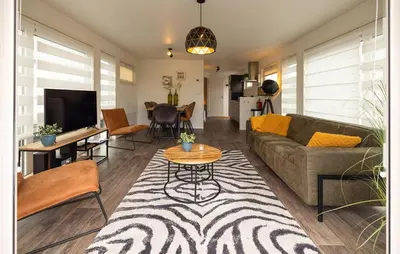 a living room with a couch and a table at 2 Bedroom Stunning Ship In Aalsmeer in Aalsmeer