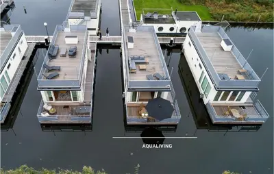 an overhead view of a dock with a boat in the water at Awesome Ship In Aalsmeer With Lake View in Aalsmeer