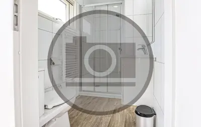 a bathroom with a shower with a round mirror at Stunning Ship In Aalsmeer With Kitchen in Aalsmeer