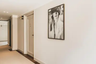 a room with a picture of a woman on a wall at Boutique Hotel Weesp in Weesp