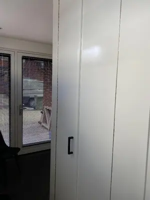 a door to a room with a window and a chair at Studio34 Zandvoort free parking in Zandvoort