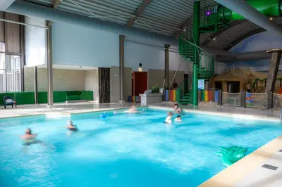 a group of people in a swimming pool at Vakantiepark Koningshof in Rijnsburg