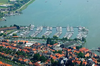 an aerial view of a harbor with boats in the water at 6 personen luxe houseboat Splendid Monnickendam nabij Amsterdam in Monnickendam