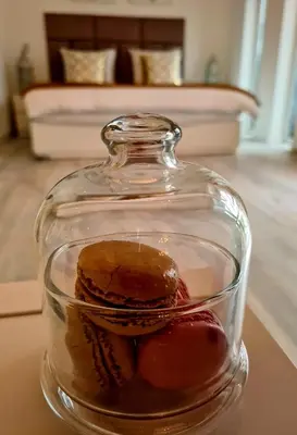 a glass jar with a dessert in it on a table at Amberdi Apartment Amsterdam Schiphol Airport in Hoofddorp