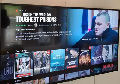 a television screen with movies on it at Amberdi Apartment Amsterdam Schiphol Airport in Hoofddorp