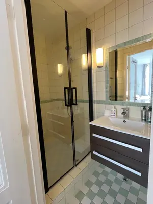 a bathroom with a shower and a sink at Studio en deluxe appartement Blueberry in Zandvoort