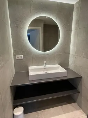 a bathroom with a sink and a mirror at Appartementen Zeezicht - 7 in Katwijk aan Zee