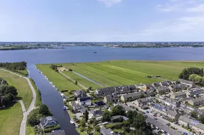 an aerial view of a town next to a river at Appartement YCW 'Papillon' in Rijnsaterwoude