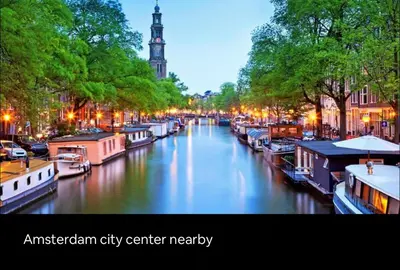 a river with boats in a city center at night at Wellness bungalow with jacuzzi &sauna&private garden near Amsterdam in Vijfhuizen