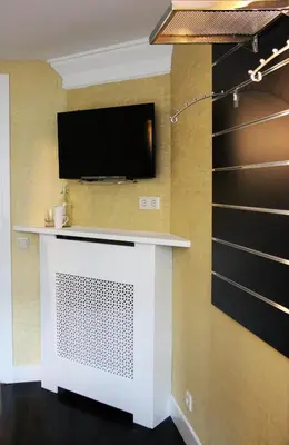 a living room with a tv on a wall at House of Freddy in Amsterdam