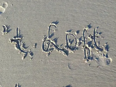 a word written in the sand on the beach at Appartement 't Loft in Zandvoort