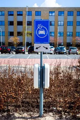 a blue sign in front of a parking lot at Bastion Hotel Amersfoort in Amersfoort