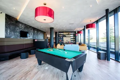 a billiard room with a pool table at Bastion Hotel Amersfoort in Amersfoort