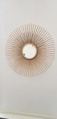 a circular mirror hanging from a ceiling at Vakantiehuis Katwijk in Katwijk