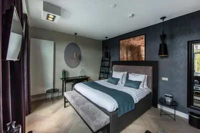 a bedroom with a large bed and a desk at No. 377 House in Amsterdam