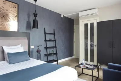 a bedroom with a bed and a blue wall at No. 377 House in Amsterdam