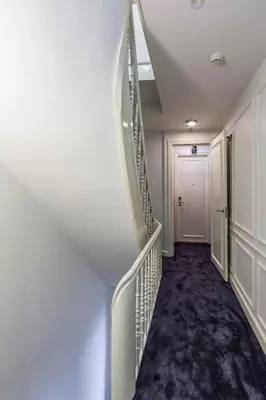 a hallway with a staircase in a building at No. 377 House in Amsterdam