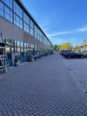 a brick building with cars parked in front of it at Studio 28A5 with free parking place in Amsterdam