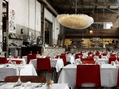 a dining room with white tables and red chairs at Studio 28A5 with free parking place in Amsterdam