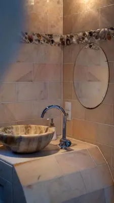 a sink in a bathroom with a mirror at Amsterdam Center - Houseboat by Captain Ricard in Amsterdam