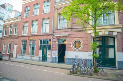 a brick building with bikes parked in front of it at Golden Mansion Apartment Hotel in Amsterdam