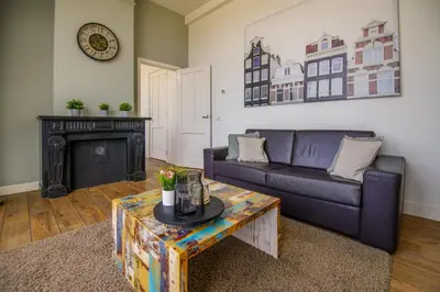a living room with a couch and a coffee table at 2L De Volharding in Leiden
