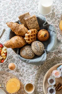 a plate of bread and pastries on a table at de Zuiderstolp in Zuidermeer
