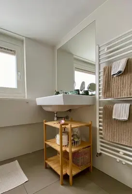a bathroom with a sink and a mirror at Romantic Wellness BnB Noordwijk in Noordwijk aan Zee