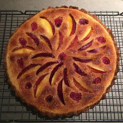 a cake sitting on top of a cooling rack at Romantic Wellness BnB Noordwijk in Noordwijk aan Zee