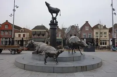a statue of animals and a cat on top of a fountain at Studio, 21 minutes by bus to downtown Amsterdam in Purmerend