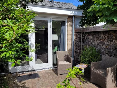 a sliding glass door on a house at Ferienhaus Noordwijk Zee & Strand in Noordwijk