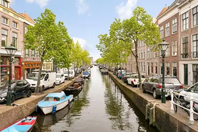 a canal in a city with boats in it at CASASdeCASPER - Apartment Alkmaar in Alkmaar