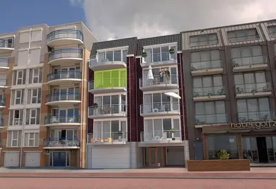 an apartment building with balconies on a city street at Boulevard Suites in Egmond aan Zee