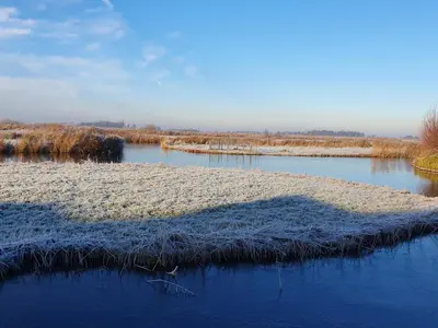 a small island in the middle of a river at Walvisch van Ghyspe in Wormer