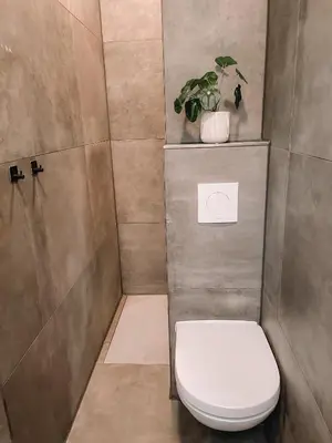 a bathroom with a toilet and a potted plant at Coolest Apartments in Haarlem City - close to Beach and Amsterdam in Haarlem