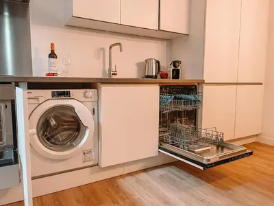 a kitchen with a washer and a dishwasher at Coolest Apartments in Haarlem City - close to Beach and Amsterdam in Haarlem