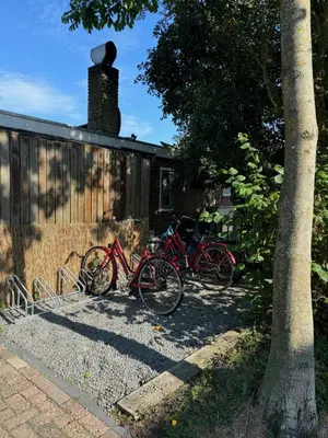 a group of bikes parked next to a house at Zee & Zand in Noordwijk