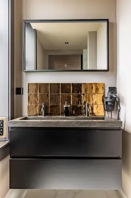a bathroom with a sink and a mirror at ShortStay Gouda in Gouda