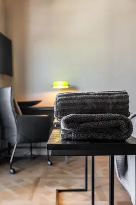 a pile of towels sitting on top of a table at ShortStay Gouda in Gouda
