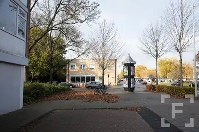 a clock on the side of a city street at Luxurious Private Studio Amsterdam Zuid in Amsterdam